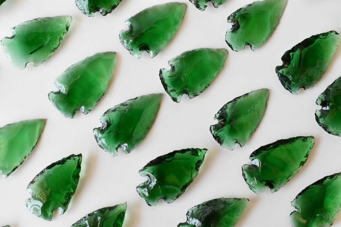 1.25'' Green Glass Arrowhead Point.
