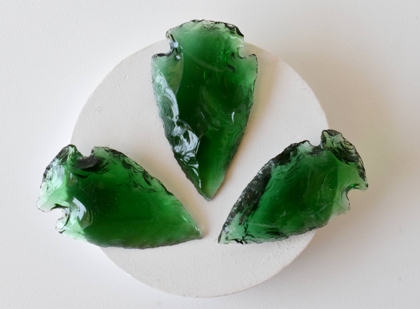 1.25'' Green Glass Arrowhead Point.