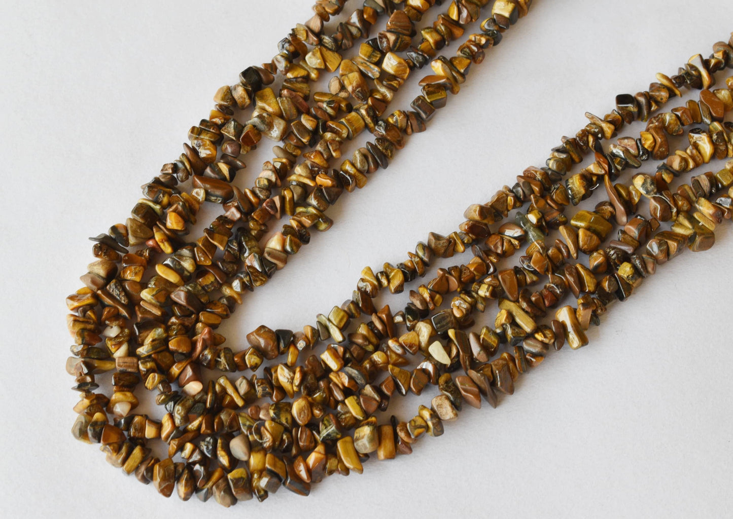 Uncut Tiger Eye Crystal Chip Beads