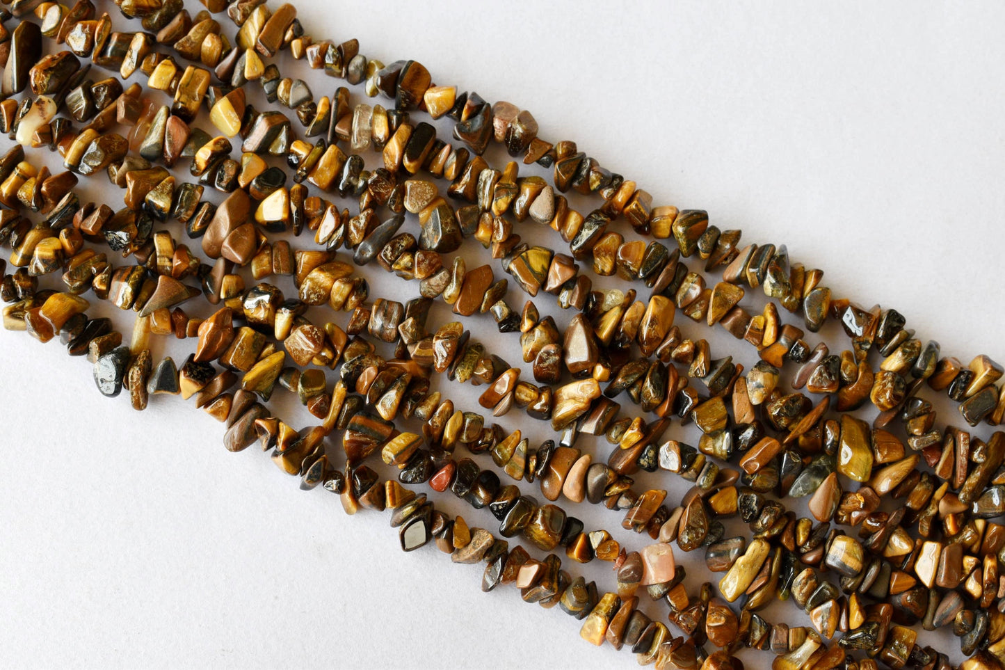 Uncut Tiger Eye Crystal Chip Beads