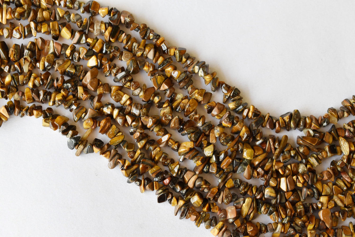Uncut Tiger Eye Crystal Chip Beads